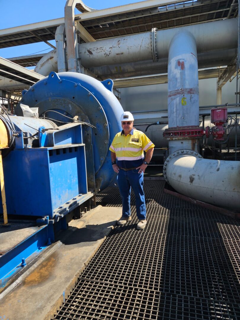 Daytime mine with a man in the center – CACS engineering management